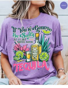 Get ready to spice up your wardrobe with the Salty Tequila Vibes Tee! Perfect for those who know how to balance a bit of sass with a lot of fun, this shirt features a cheeky message: "If you're gonna be salty, at least bring some tequila." Made from soft, breathable fabric, this tee is ideal for casual outings, beach days, or just hanging out with friends. Pair it with your favorite jeans or shorts for a laid-back yet playful look. Whether you're a tequila lover or just enjoy a good laugh, this shirt is a must-have addition to your collection. Cheers to good times and salty vibes! Fun Graphic Print Tops For Cinco De Mayo, Fun Tops With Funny Print For Cinco De Mayo, Fun Cinco De Mayo Tops With Funny Print, Fun Cinco De Mayo Funny Print Tops, Stay Salty Svg, Cheap Beachy T-shirt With Funny Print, Stay Salty Shirt, Tequila Shirts Women, Sip Happens