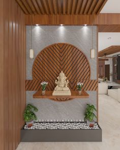 a buddha statue sitting on top of a wooden shelf in a living room next to potted plants