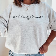 This wedding planner crewneck sweatshirt is perfect for any wedding planner! Style this trendy sweatshirt with some jeans for an easy, cute outfit! This classic unisex heavy blend crewneck sweatshirt is pure comfort. Fuzzy inside makes it oh so cozy! ☻ THIS IS A PHYSICAL ITEM! ☻ * 50% cotton & 50% polyester * Adult Unisex * Medium weight fabric (8.0 oz/yd²) * Gildan brand * Crew Neck ☻ SIZING ☻ PLEASE CHECK THE SIZE CHART IMAGE TO HELP YOU CHOOSE THE BEST FIT! WE DO NOT ACCEPT EXCHANGES, RETURNS Trucker Wife, Wife Sweatshirt, Wedding Sweatshirts, Truckers Wife, Gifts For Truckers, Proud Wife, Brides Babes, Wife Birthday, Wedding Shirts