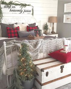 a bedroom decorated for christmas with white and red accents