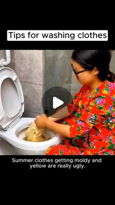 a woman sitting on top of a toilet in a bathroom next to a white toilet