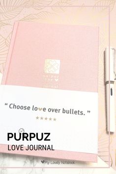 a pink notebook with the words choose love over bulletins on it next to a pen