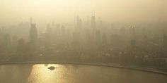 an aerial view of a large city in the fog