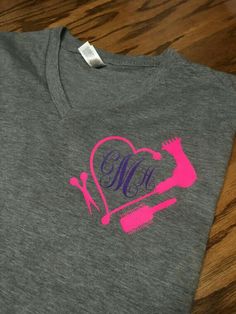 a gray t - shirt with a pink heart and the word monogrammed on it