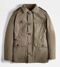 Field jacket in comfortable stretch fabric, with water-repellent, windproof and breathable membrane. Characterized by four pockets with button, it comes with an internal drawstring waistband. Featuring a shirt collar, it is fastened with branded buttons and double-slider concealed zip, profiled with leather tape. Lined in wool jersey, this urban garment is enriched by refined iconic detailing: the rectangular leather patch on the back with stamped Tod's logo, collar band and shaped zip pulls, in Green Outdoor Outerwear With Patch Pockets, Green Outerwear With Patch Pockets For Outdoor, Functional Khaki Outerwear With Flap Pockets, Green Outerwear With Flap Pockets For Outdoor Activities, Green Utility Jacket With Flap Pockets For Outdoor, Khaki Travel Parka With Pockets, Green Outerwear With Flap Pockets For Outdoor, Travel Outerwear With Cargo Pockets And Long Sleeves, Long Sleeve Outerwear With Cargo Pockets For Travel