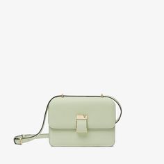 Named after the emerging cultural hotspot in Milan, the NoLo handbag is an ode to the energy of our hometown. This mini version arrives in our signature Millepunte calf skin, its multidimensionality heightened by its striking mint green hue. Inspired by our archive, its lock has a distinctive asymmetrical V-cutout with a magnet concealed behind it. With one central compartment for everyday essentials and an external pocket for easy access to regularly used items. Versatile Green Formal Shoulder Bag, Luxury Green Tote Flap Bag, Green Square Flap Bag In Modern Style, Green Square Flap Bag Modern Style, Modern Green Box Bag With Detachable Strap, Modern Green Flap Shoulder Bag, Modern Green Shoulder Flap Bag, Modern Green Square Flap Bag, Modern Square Green Flap Bag