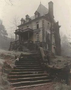 an old abandoned house with stairs leading up to the front door and second story on a foggy day