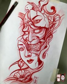 a drawing of two faces with red ink