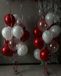 red and white balloons are hanging from the ceiling