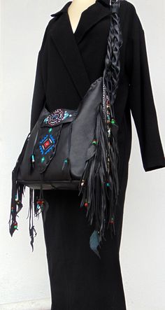 Black Handmade Crossbody Leather Bag. Native American inspired Handmade Leather Fringed Handbag. Genuine Leather. Crossbody or Shoulder Bag depend your mood !! Beautiful Ethnic Handbag with Fringes and Beads. Painted with Native American Symbols-Desings- embroidered with nice colors! Both side of the Bag are Fringed and decoraded with beats-(you can ad your personal charms if you want). I enjoy every moment creating this exceptional Bag. Become better with hard use. I wish that who ever purchase Leather Fringe Hobo Bag For Festivals, Artisan Bag With Adjustable Strap For Festival, Artisan Festival Bag With Adjustable Strap, Bohemian Handmade Travel Shoulder Bag, Bohemian Rectangular Hobo Bag, Bohemian Leather Hobo Bag With Tassels, Handmade Hippie Hobo Bag For Travel, Festival Tote Shoulder Bag With Hand-stitched Details, Bohemian Leather Shoulder Bag With Fringe