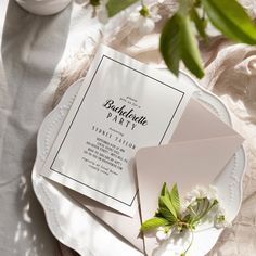 a table topped with white plates and flowers