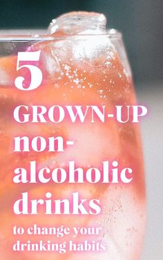 a close up of a drink in a glass with the words grown - up non alcoholic drinks to change your drinking habit