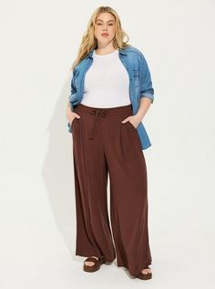 FIT High rise. Wide leg silhouette. . 30” inseam. . MATERIALS + CARE Washable Gauze woven fabric: The lightweight, breathably soft fabric you love is, at last, wash, wear and go! . Stretch level: None. 74% rayon, 26% polyester. Machine wash cold. Tumble dry low. Imported. DETAILS Pull-on elastic waistband. Drawstring detail. . The best plus size women's long, tall pull-on wide leg washable gauze high rise pant pants in deep mahogahny made of washgauze. Rock your look from Torrid to Festivals lik Wide Leg Chambray Pants Outfits, Fall Wide-leg Rayon Pants, Versatile Rayon Pants With Pockets, Stretch Rayon Fall Bottoms, Fall Rayon Bottoms For Loungewear, Fall Wide Leg Rayon Pants, Versatile Rayon Bottoms With Pockets, Fall Rayon Pants With Elastic Waistband, Casual Rayon Bottoms For Fall