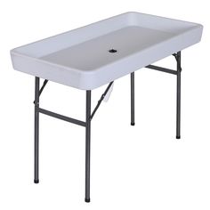 a white sink sitting on top of a metal frame