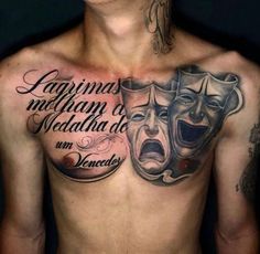 a man with a mask on his chest and some words written in spanish above it