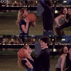 two people are playing with a basketball in the park