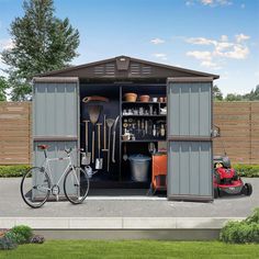 an outdoor storage shed with its doors open and two bicycles parked in the driveway next to it