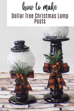 two snow globes decorated with pine cones and plaid bows are sitting on a table