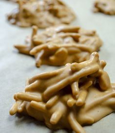 some cookies that have been made to look like they are covered in peanut butter and drizzled with icing