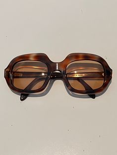 A vintage 1970's pair of Pierre Cardin sunglasses in an unusual rectangular style shape and in a faux tortoiseshell colour/pattern A great piece from this exciting era of Pierre Cardin In very good vintage condition but does have signs of wear consistent with its age. Lenses have micro scratches, please message for more info.  Comes with vintage Pierre Cardin soft case  Made in France Vintage Tortoiseshell Sunglasses With Gradient Lenses, Vintage Brown Sunglasses With Mirrored Lenses, Retro Tortoiseshell Polarized Sunglasses, Vintage Brown Sunglasses For Summer, Retro Brown Square Frame Sunglasses, Mid-century Brown Tinted Sunglasses, Vintage Tortoiseshell Sunglasses For Summer, Vintage Tortoiseshell Rectangular Sunglasses, Vintage Brown Rectangular Sunglasses