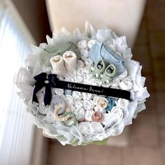 a bouquet made out of baby's booties and diapers