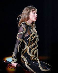 taylor swift performing on stage at the brity awards