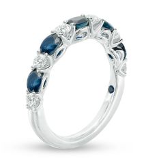 Honor the woman you love with this round diamond and oval blue sapphire alternating band from the Vera Wang Love Collection. Fashioned in 14K white gold Round diamonds alternate with 4 x 3.0mm oval-shaped brilliant blue sapphires, creating a unique and colorful look. A single blue sapphire is set into the shank, the signature of the collection and a symbol of faithfulness and everlasting love. This band captivates with 3/8 ct. t.w. of diamonds. Designed for the Diamond Store®. Mismatched Wedding Bands, Vera Wang Wedding Rings, Blue Sapphire Wedding Band, Vera Wang Wedding, Sapphire Wedding Band, Stackable Wedding Bands, Sapphire Band, Eternity Wedding Band, Anniversary Bands