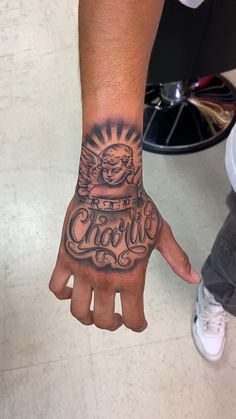 a man with a tattoo on his hand and the words crani written in it