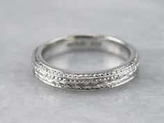 A beautiful platinum band for wearing as a wedding ring, this would make a great stacking ring, as well! The pattern is pretty, what we call a wheat pattern, and is classic for the era. Metal: Platinum Width of Band: 3.8 mm Height off Finger: 2.1 mm Ring Size: 6.50 Marks: "90% PLAT CTI" Stamped on the inside band Classic Stackable Engraved Ring, Heirloom Engraved Stackable Ring For Formal Occasions, Classic Platinum Rings With Decorative Band, Classic Platinum Jewelry With Decorative Band, Classic Wedding Stackable Rings In Platinum, Classic Promise Ring With Decorative Band, Classic Engraved Stackable Ring For Anniversary, Heirloom Style Formal Stackable Rings With Decorative Band, Formal Heirloom Stackable Rings With Decorative Band