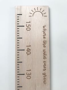 a wooden ruler with words on it