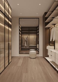 an empty walk in closet with clothes hanging on the walls and shelves next to it