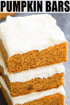 pumpkin bars stacked on top of each other with white frosting