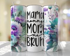 three coffee mugs sitting on top of a table with the words mom in the world printed on them