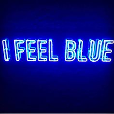 a neon sign that says i feel blue