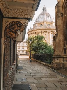 an old building with a dome in the background