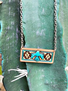 Bring a touch of handmade charm to any outfit with our leather tooled bar necklace. This necklace features intricate tooling designs that add a unique flair. Perfect for adding a bohemian twist to any look. 18″ + 3 ” EXT Tooled Leather Necklace, Casual Country Outfits, Casual Bodysuit, Accessories Rings, Handmade Charms, Country Outfits, Leather Necklace, Leather Tooling, Bar Necklace