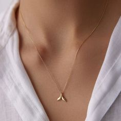 🌟 14K Gold Whale Tail Necklace 🌟 Embrace the majesty of the ocean with our 14K Gold Whale Tail Necklace. This elegant piece captures the strength and beauty of the whale, symbolizing freedom, power, and deep connection to the sea. Perfect for ocean lovers and adventurers, this necklace adds a touch of marine-inspired elegance to any outfit. Whether worn alone or layered, it's a timeless reminder of the ocean's wonders and a unique addition to your jewelry collection. 🐋✨ Available in three gor Elegant Yellow Gold Fish Shaped Necklace, Gold Mermaid Tail, Gold Whale, Whale Tail Necklace, Dolphin Fish, Gold Necklace For Women, Gold Mermaid, Mermaid Jewelry, Fish Tail