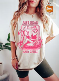 Comfort Colors Just Read A Book And Chill Shirt, Funny Book Gift For Women, Reading Teacher Tshirt, Bookish Tee Book Lover Tee Bookworm gift If you are looking for soft, comfy t-shirts, you're in the right place!. The hearty jersey fabric is knitted of the softest 100% cotton that's ring spun, they have retro and vintage look. + Shirts are unisex sizing. It's comfortable and flattering for men and women, but may run a little large for the ladies. Please refer to the sizing chart to find your perfect fit. Please order your normal size for a regular fit, or size down for a more fitted look. Please note unisex shirts are longer than women's shirts. + MATERIAL - 100% Cotton - Imported - Pull On closure - Machine Wash - Soft washed garment dyed fabric - Double needle collar - Twill taped neck a Bookish Graphic Tees, Pink Crew Neck T-shirt With Bookish Style, Women Reading, Reading Teacher, Book Tshirts, Book Gift, Read A Book, Gifts For Bookworms, Book Girl