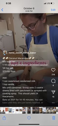 a woman in an apron is making food on the counter and looking at her cell phone