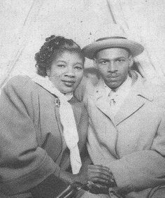 an old black and white photo of two people