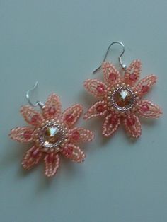 pink and white beaded earrings with flower design