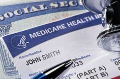 a medical health id and pen on top of some social security papers with the name medicare health in it