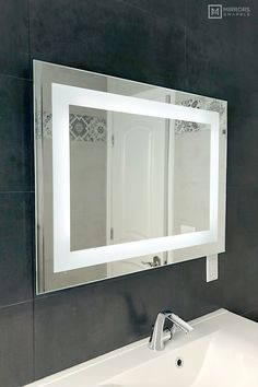 a bathroom sink with a mirror above it