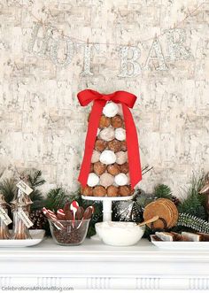 a table topped with lots of desserts and candies on top of a mantle