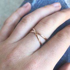 "Handmade, delicate wrap ring made with half-round wire that is shaped and lightly hammered for a gorgeous texture. The beauty about this ring is the versatility. You can wear it to show the criss-cross / \"X\" design, or flipped around so it looks like two perfect stacking rings. Each ring is made to order, specifically for you! That means each piece may vary slightly from what is pictured and will be completely unique. DETAILS: *14K Gold Fill, 14K Rose Gold Fill or Sterling Silver *USA materia Rose Gold Stackable Rings, Gold Wrap Ring, Gold Stacking Ring, Criss Cross Ring, Gold Wrap, Wrap Ring, Ring Stacking, Ring Rose Gold, Small Rose