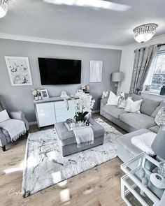 a living room filled with furniture and a flat screen tv