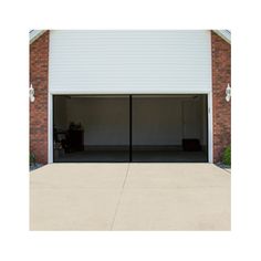 two garage doors open in front of a brick building