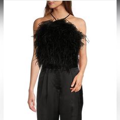 From Antonio Melani, This Blouse Features: Satin Fabrication Halter Neckline Sleeveless Button Back Closure Lined Approx. 13.5" Center Back Polyester/Elastane/Ostrich Feathers Spot Clean Imported. Formal Black Sleeveless Tank Top, Chic Sleeveless Feathered Top, Spring Night Out Tops With Feather Trim, Feather Trim Tops For Night Out In Spring, Elegant Sleeveless Blouse Tank Top For Fall, Elegant Feather Tops For Summer, Chic Summer Tops With Feathers, Elegant Feathered Evening Tops, Chic Feathered Tops For Fall