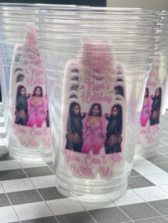 several plastic cups with pictures of women on them