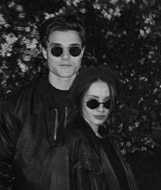 black and white photograph of two people wearing sunglasses